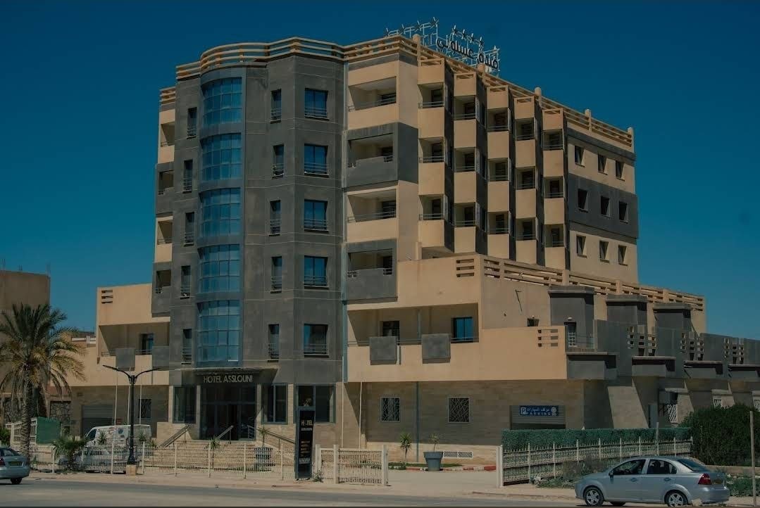 Asslouni Hotel exterior at dusk in Djelfa