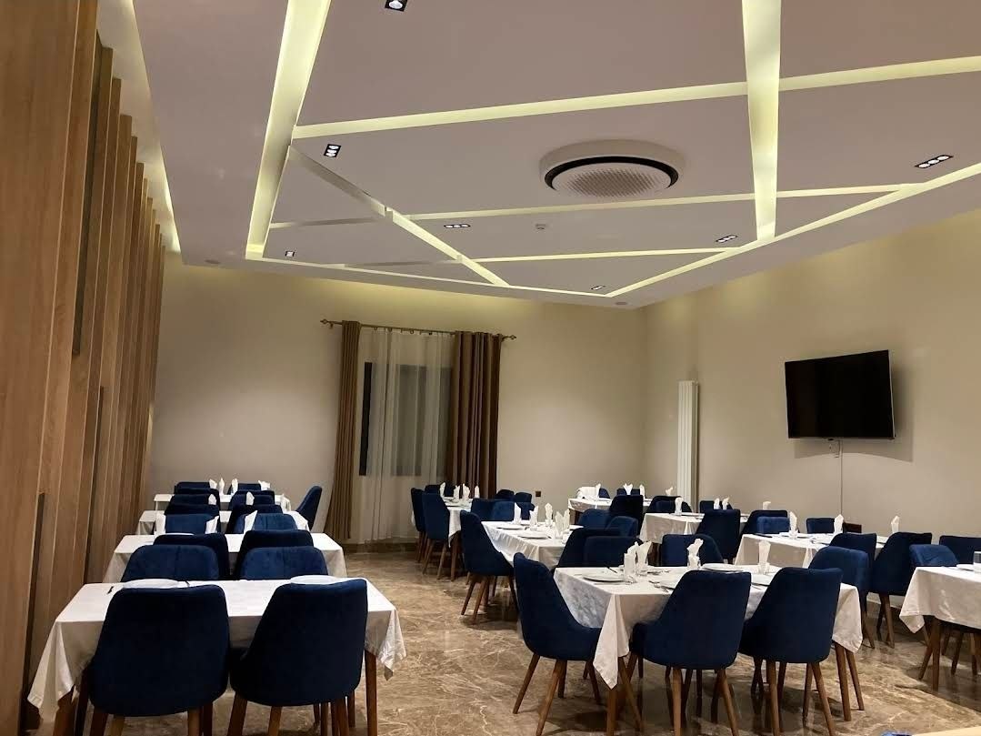 Elegant dining hall with blue velvet chairs